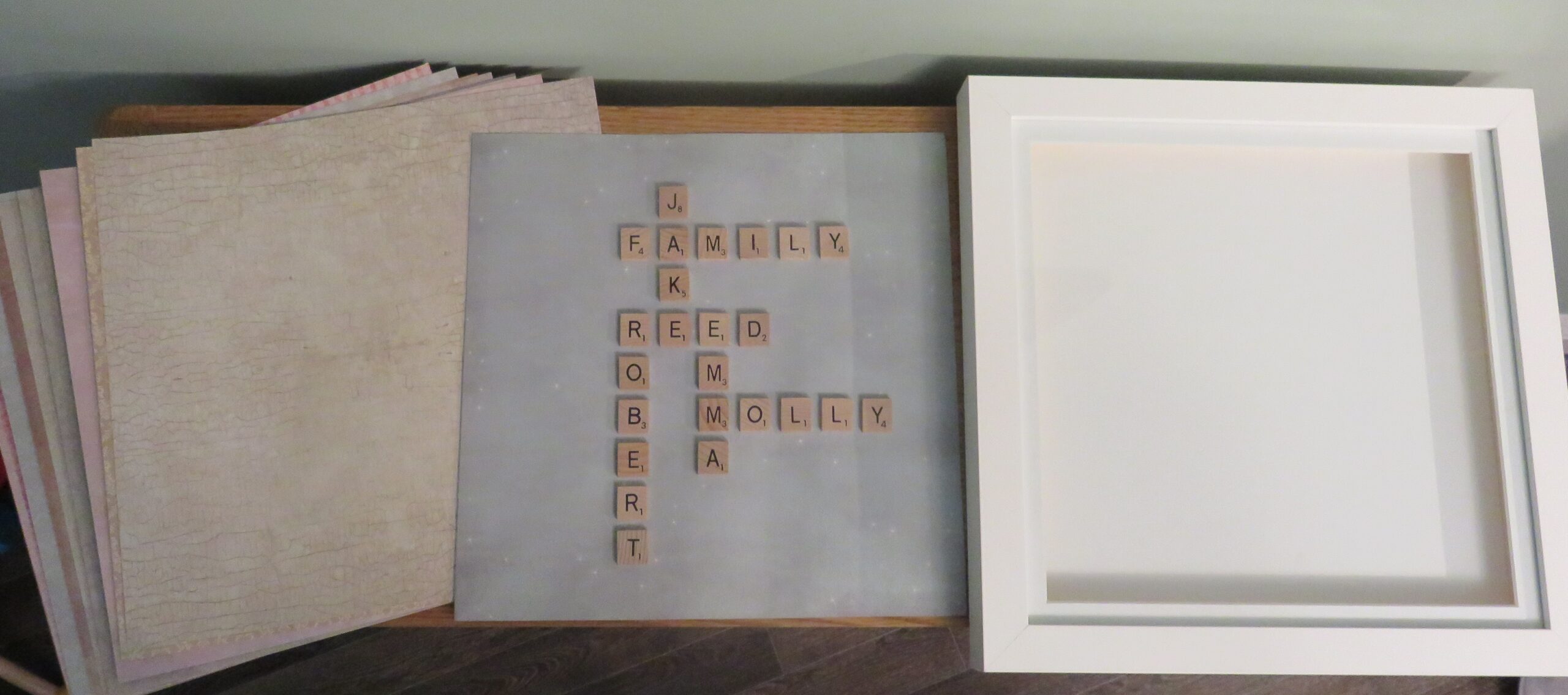 frame, card and scrabble pieces