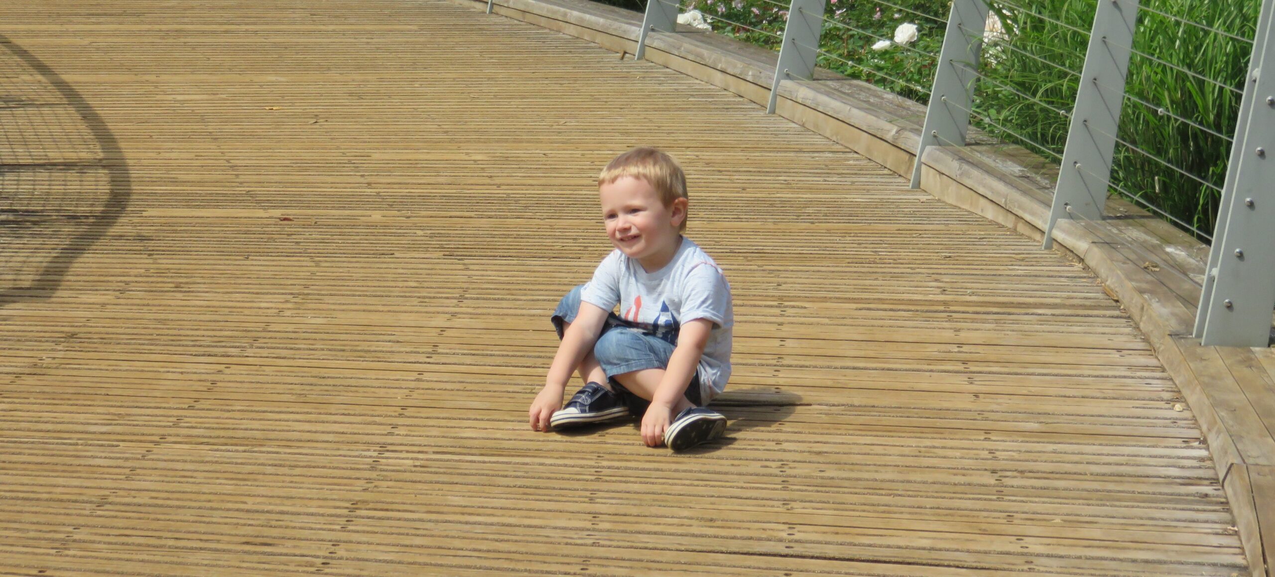 boy sat on ground- toddlerdom