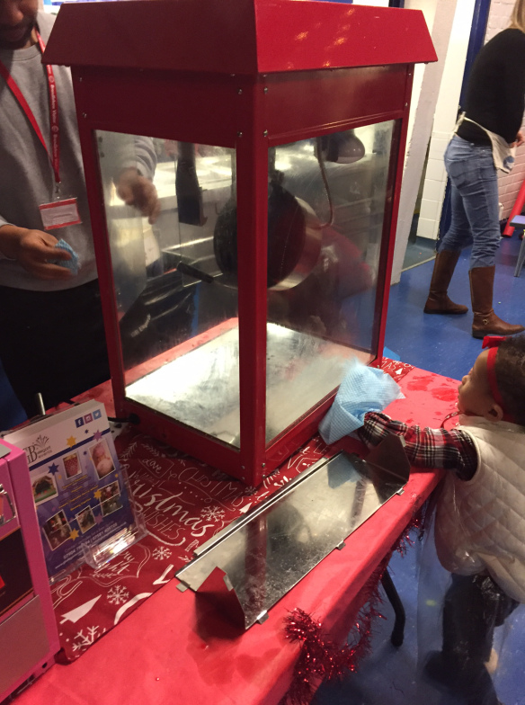 child cleaning the popcorn machine
