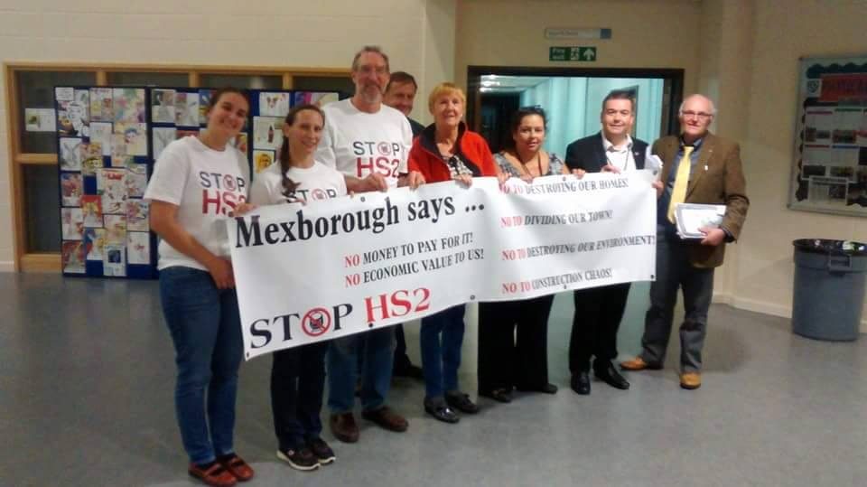 team holding up a banner against the HS2 trainline 