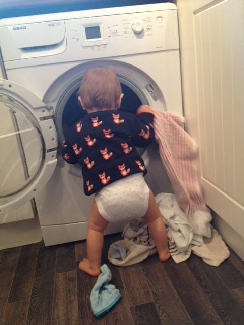 baby emptying washing machine