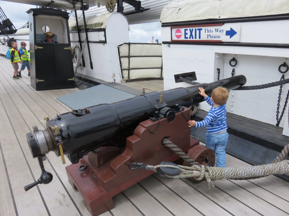 boy with canon on the ship