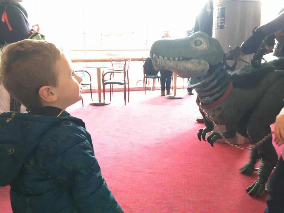 Jake looking at a dinosaur