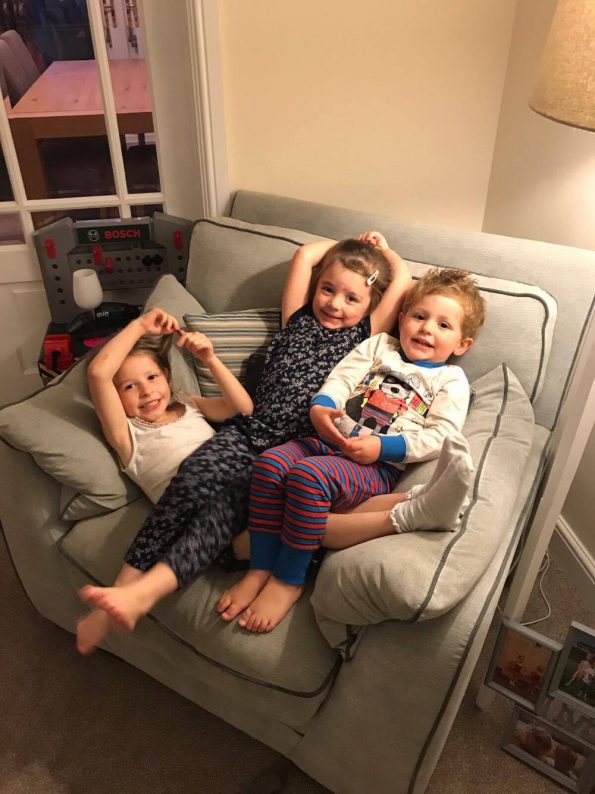 3 children sat on a chair
