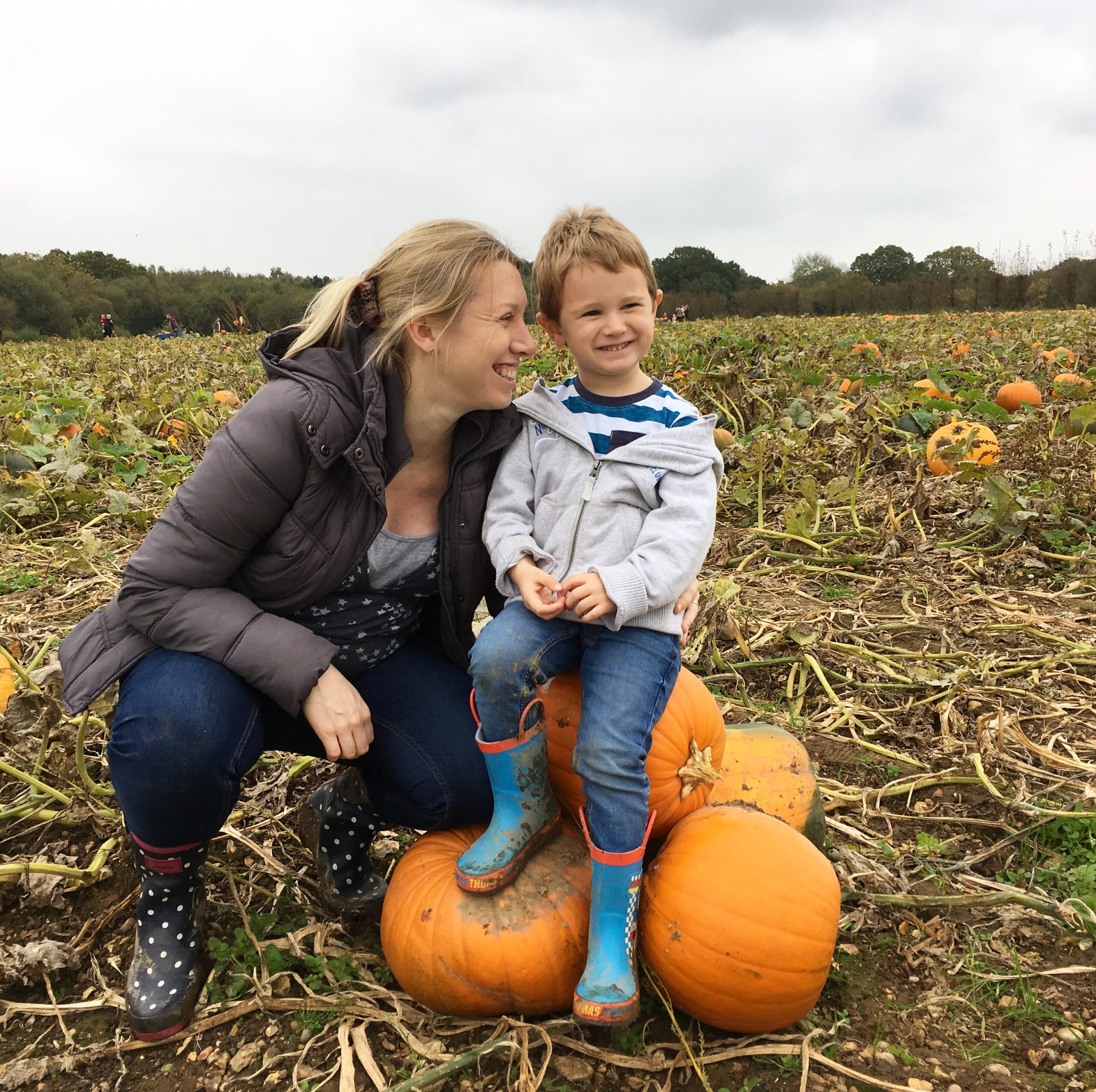 mum and child on pumpkins