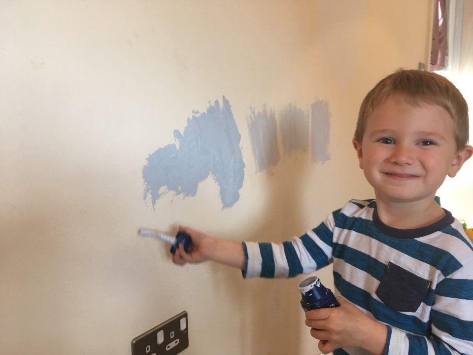 boy painting a wall