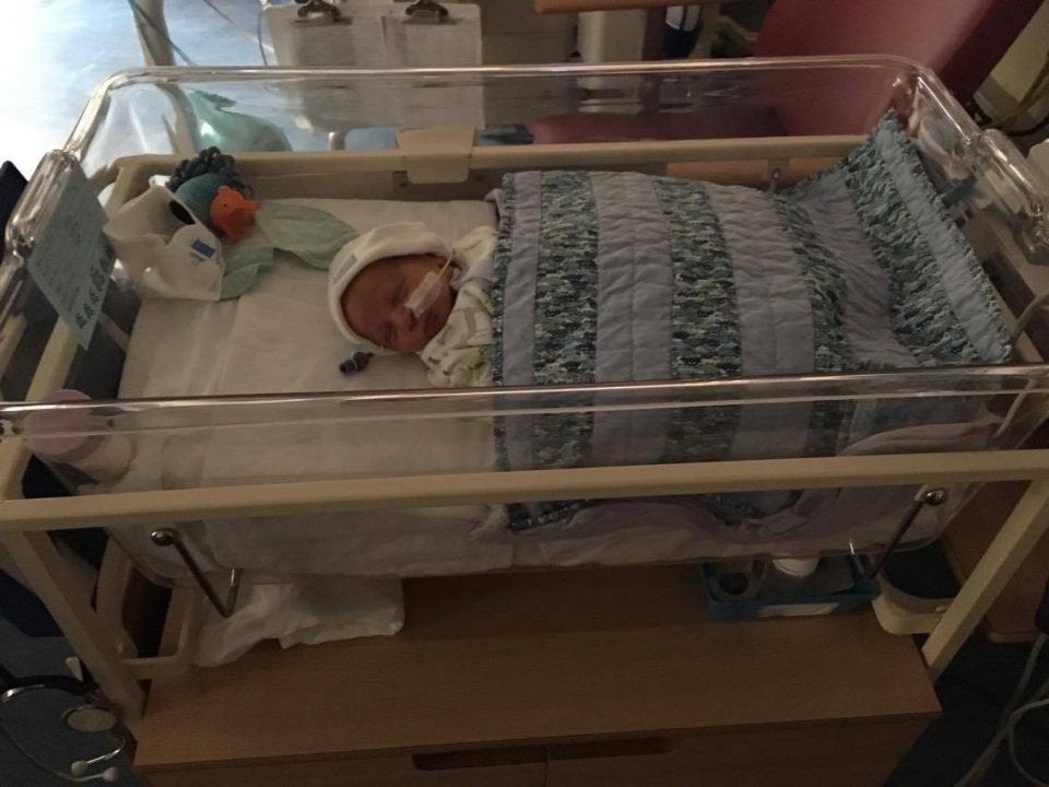 william in a cot in NICU