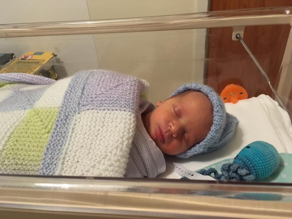 William in a hospital cot