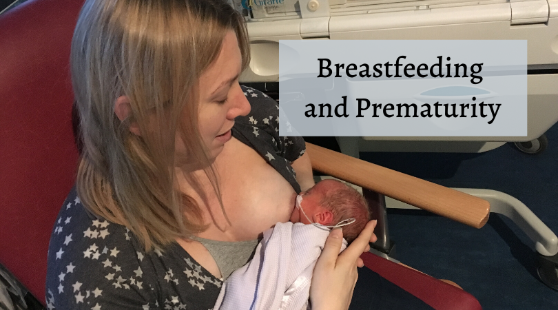 breastfeeding and prematurity- me sat feeding william for the first time in NICU