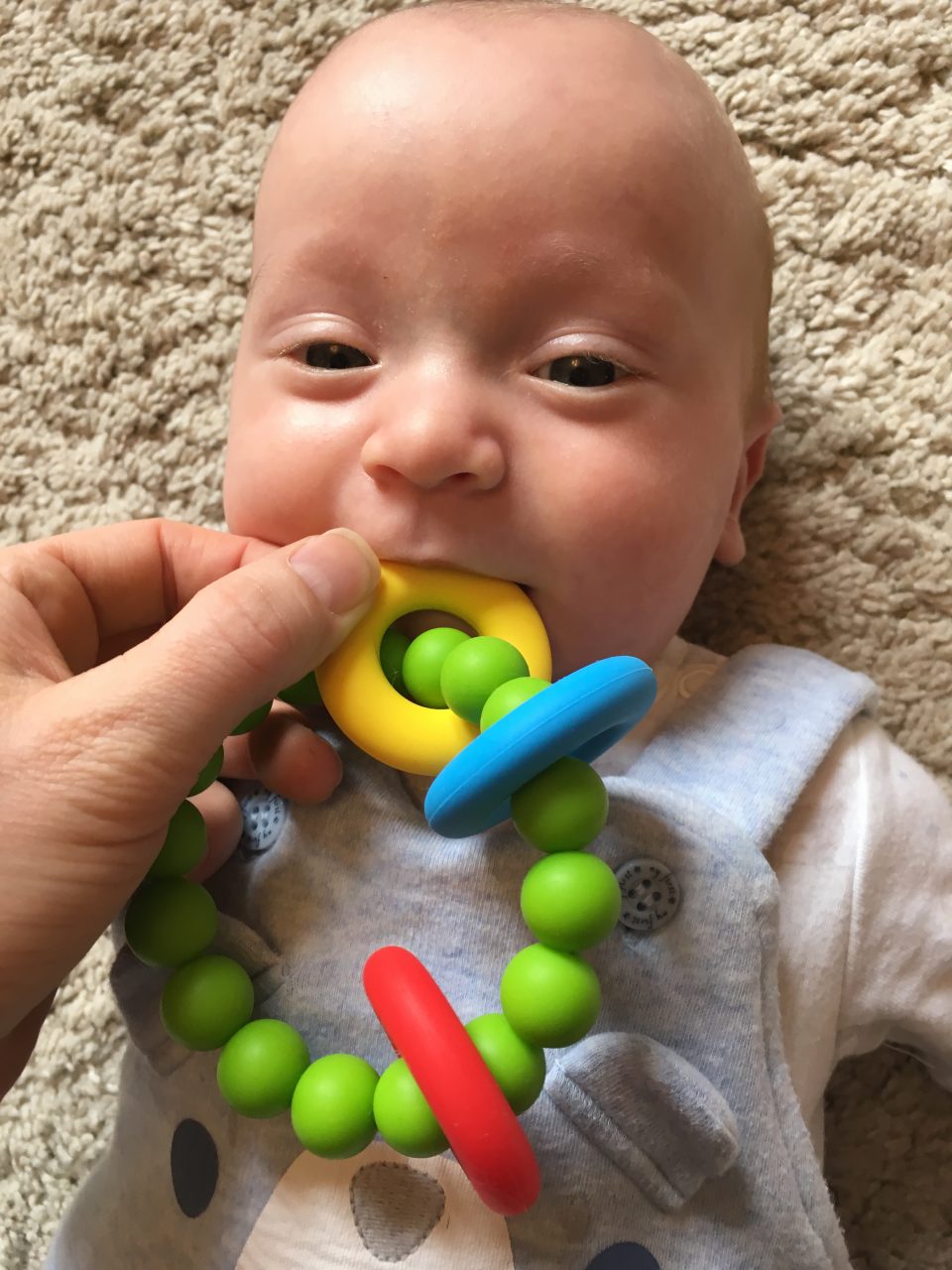 silicone teething ring in a baby's mouth from Amber Pumpkin