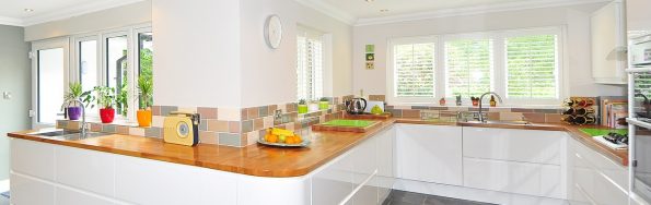 a large spacious kitchen with oak worktops