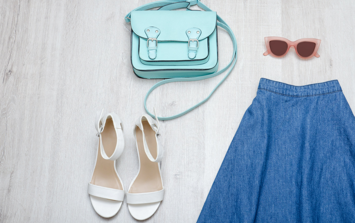 summer look of denim skirt, sandals, bag and sunglasses