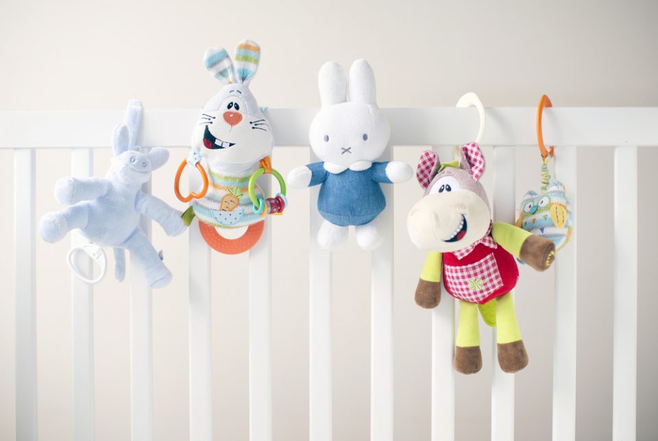 baby toys on a cot