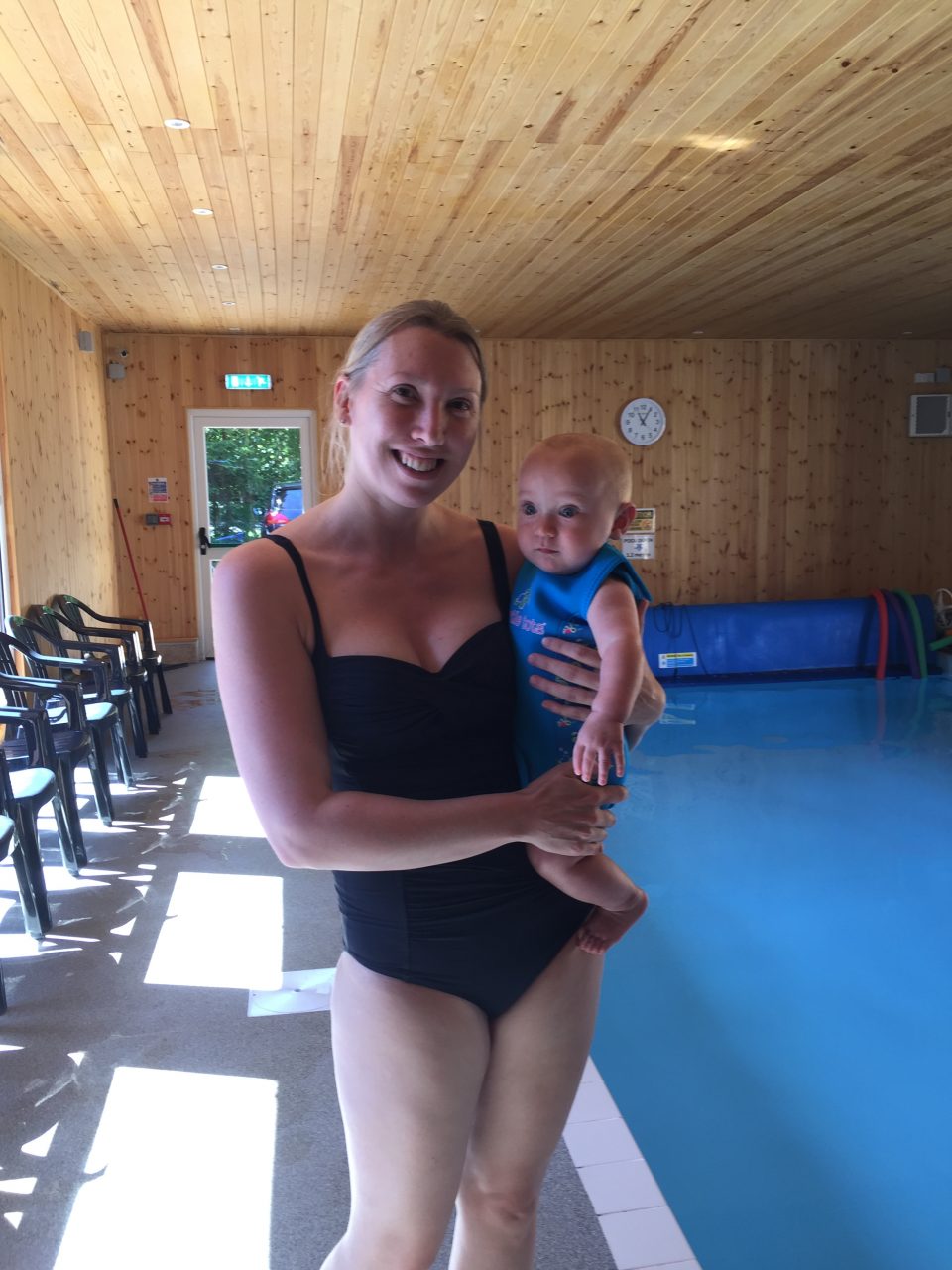 Mum and Baby stood by a pool