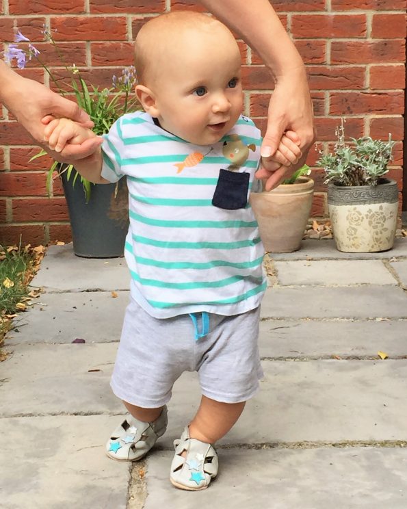 baby in his dotty fish sandals