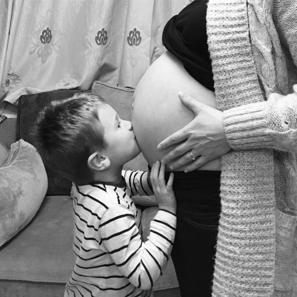 Jake kissing my baby bump, black and white photo