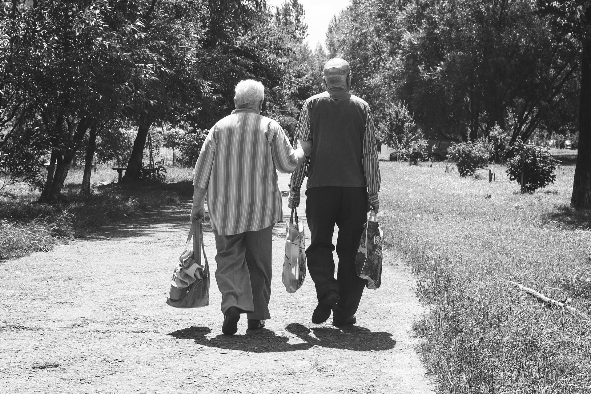 2 elderly people walking