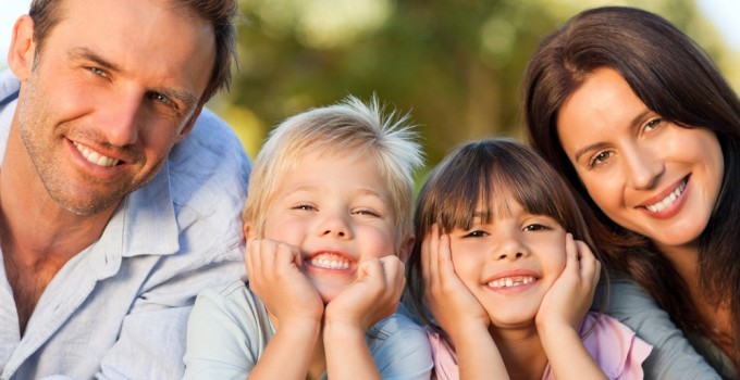 a smiling family of 4