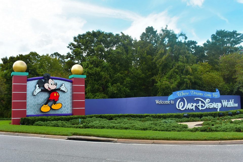 Mickey Mouse and a sign saying welcome to Walt Disney World