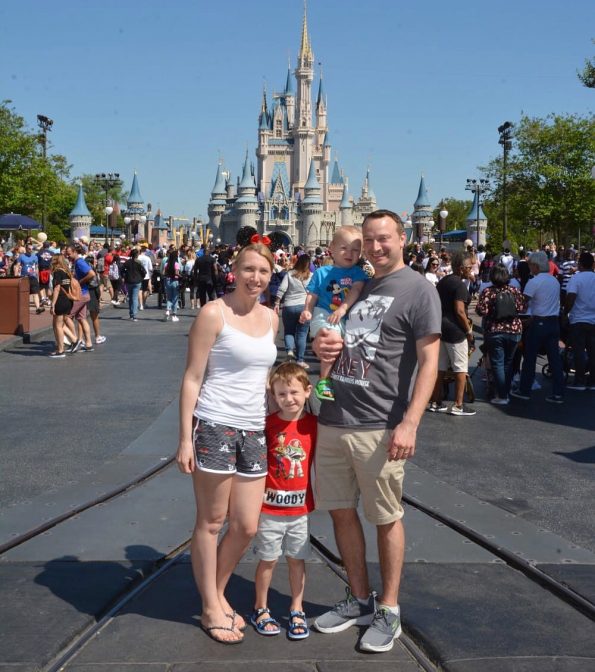 my family standing outside the castle at Disney World