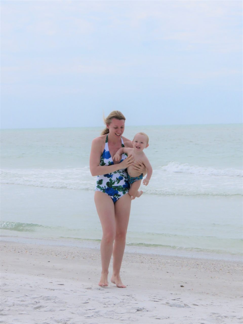 me holding baby on the beach