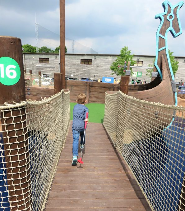 Jake running across the bridge at mighty claws adventure golf