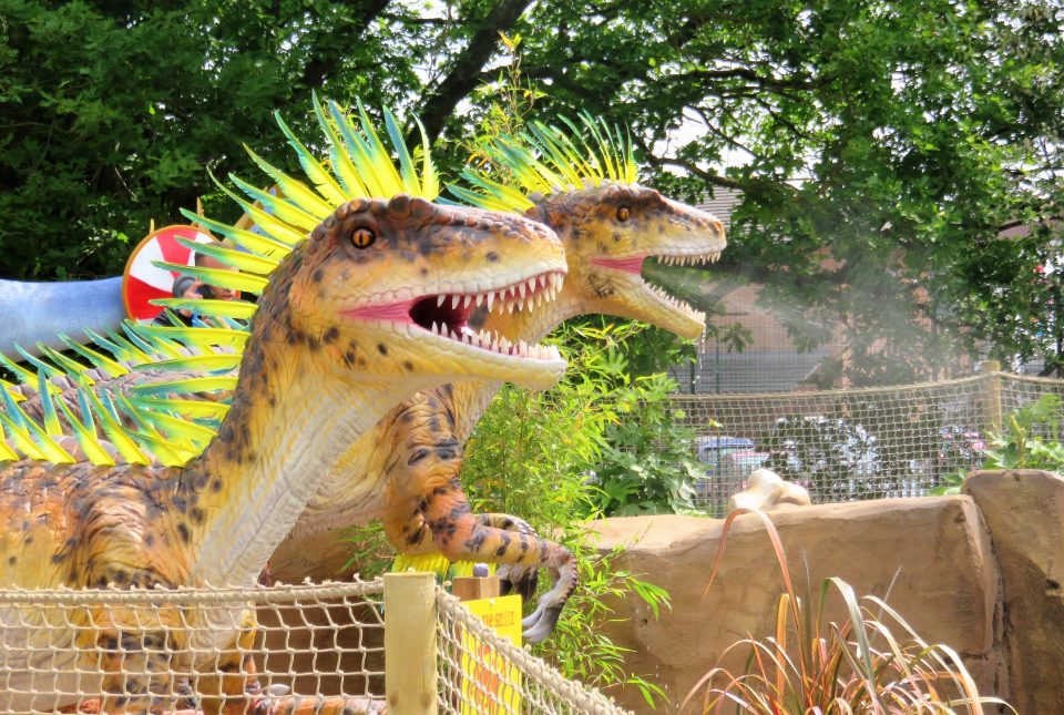 raptors that spray water at mighty claws adventure golf