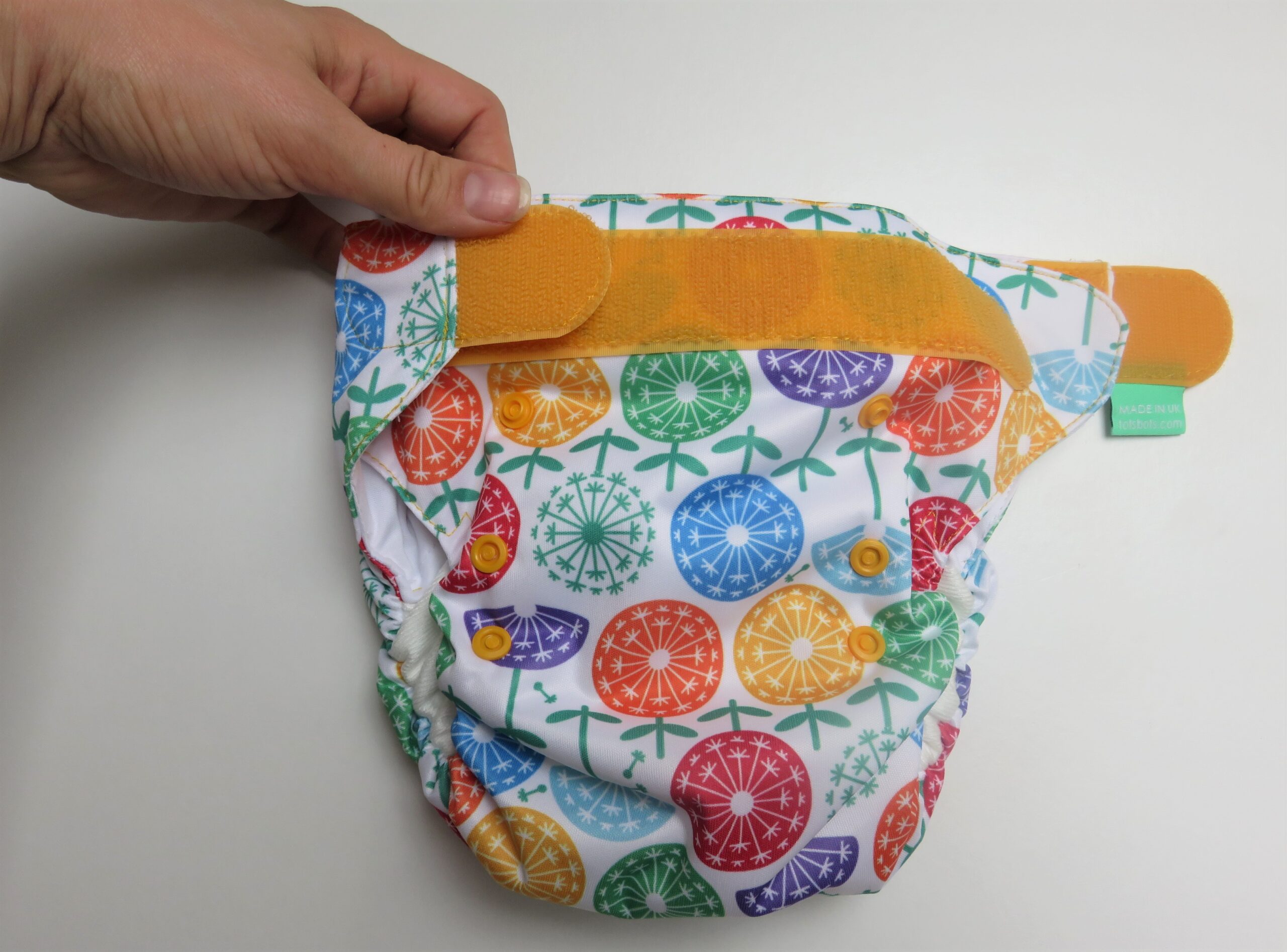 showing how the easyfits reusable nappies do up