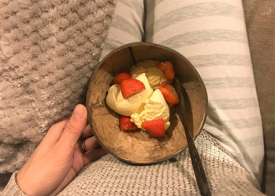 ice cream in a bowl with strawberries on top