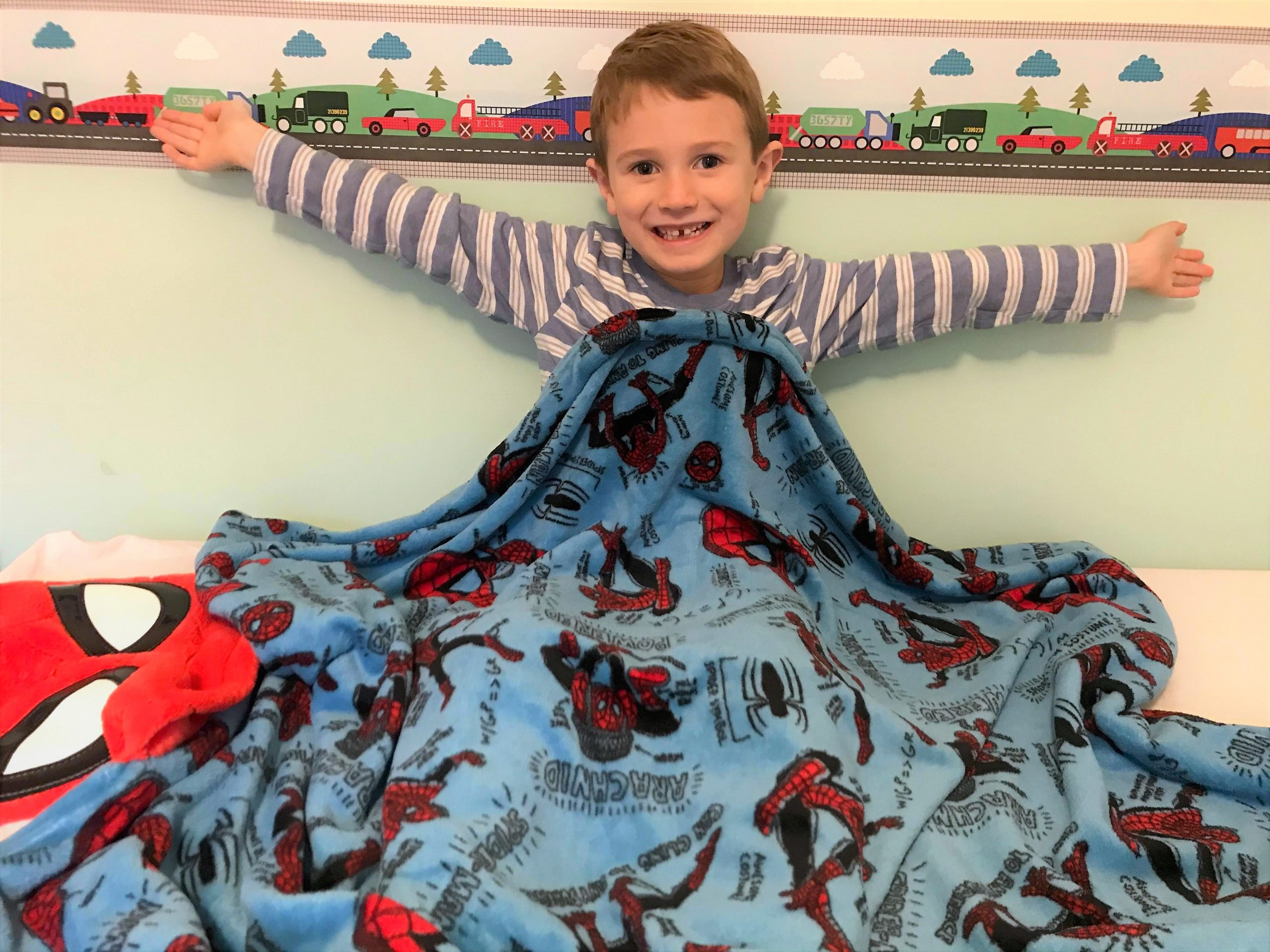 Jake with his shopDisney spiderman blanket