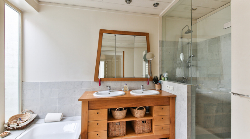 a bathroom with a pine dresser