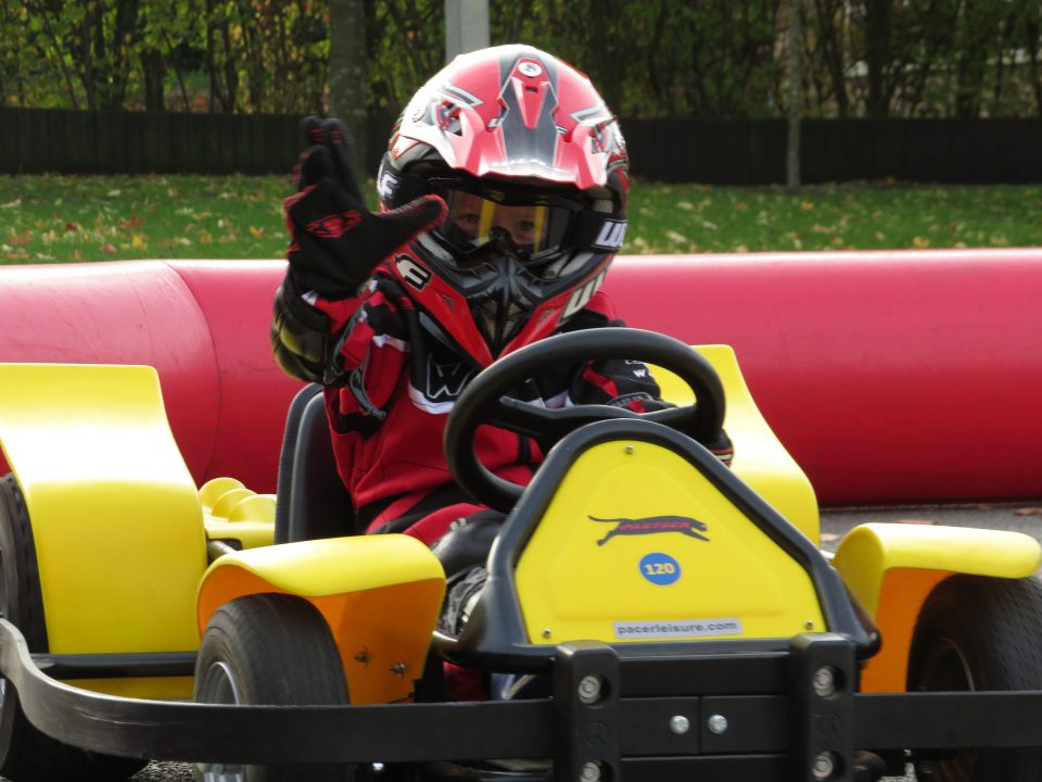 child in go-kart at barracudas activity day camp