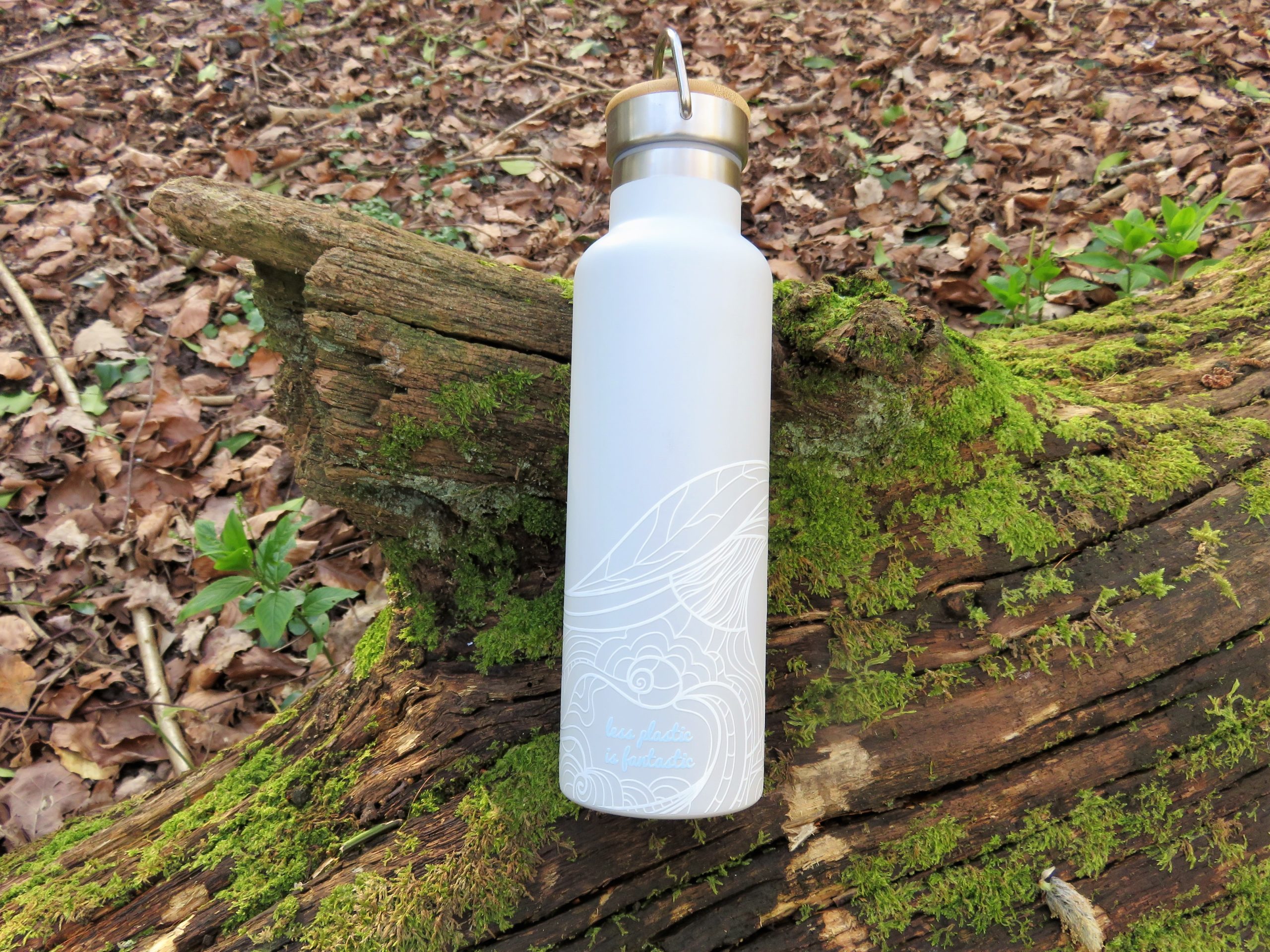 water bottle on a fallen tree