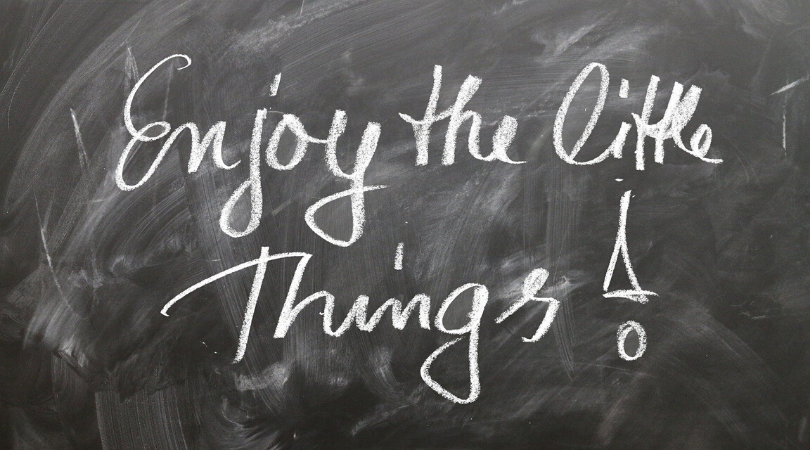 enjoy the little things! written on a blackboard