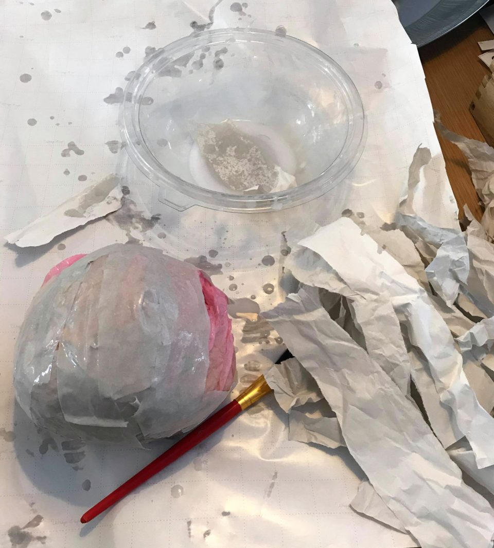 glue and water with the planet and shredded paper