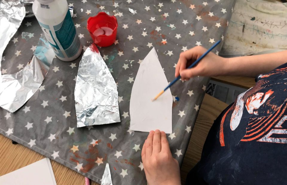 Jake glueing his foil to his rocket