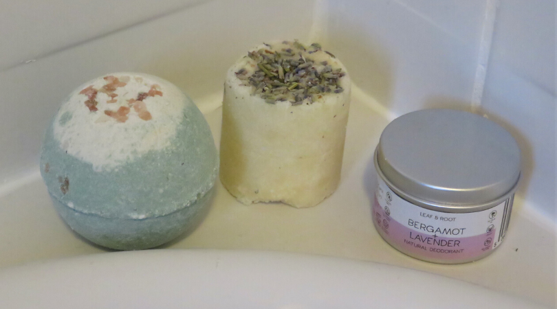 leaf and root bath bomb, scrub and deodorant on the bath