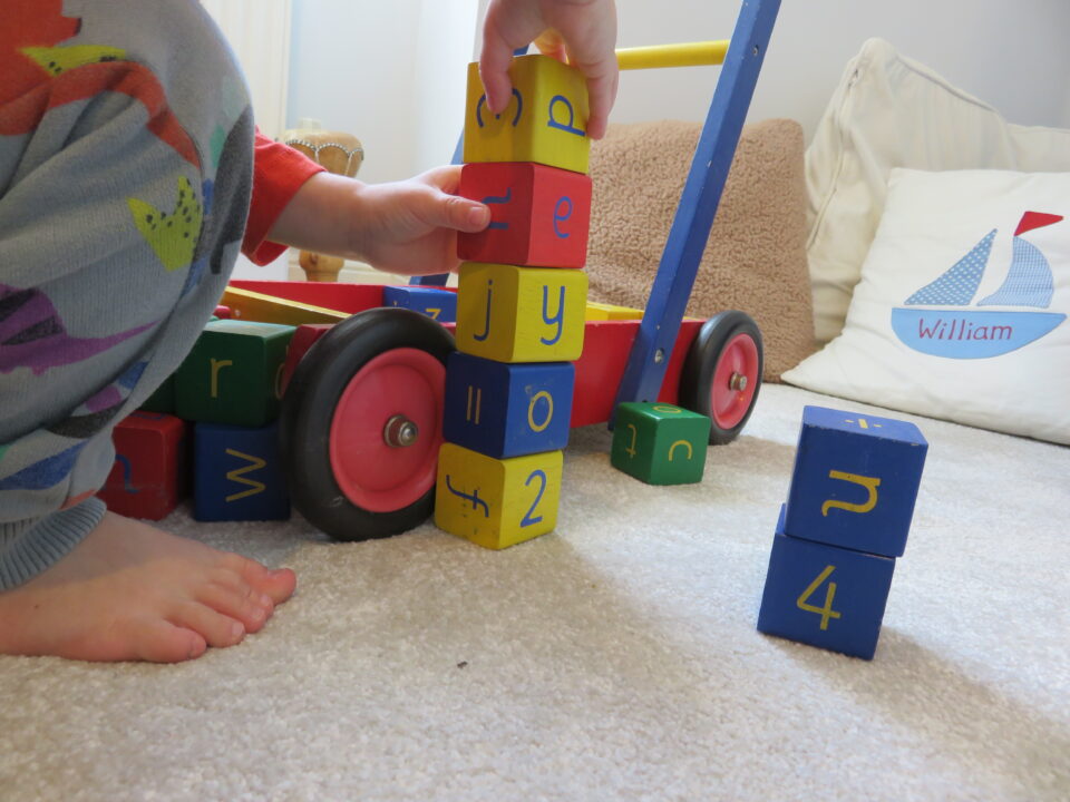 stacking up the bricks from inside the push along