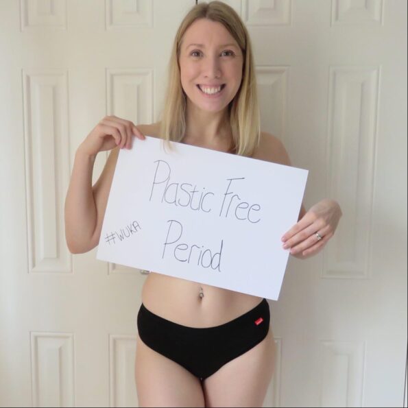 me wearing the WUKA pants and holding up a sign saying plastic free period