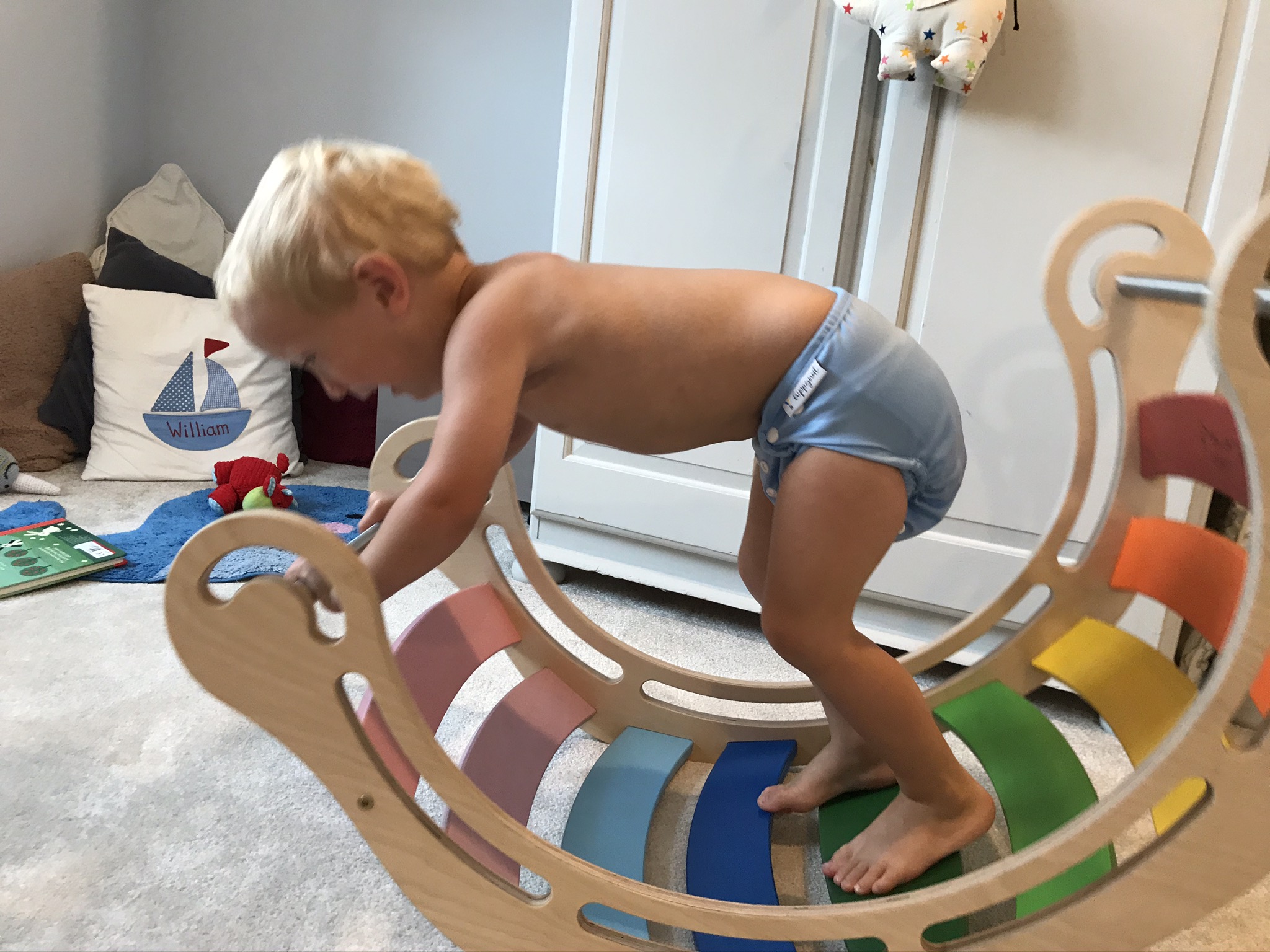 william on his wooden rocker wearing the nappy