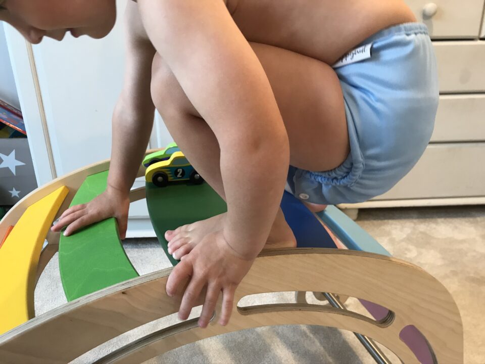 William in his hippynut nappy on his wooden climber