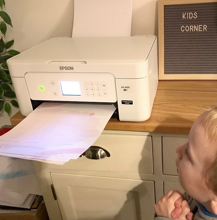 william watching his printout coming out of the printer