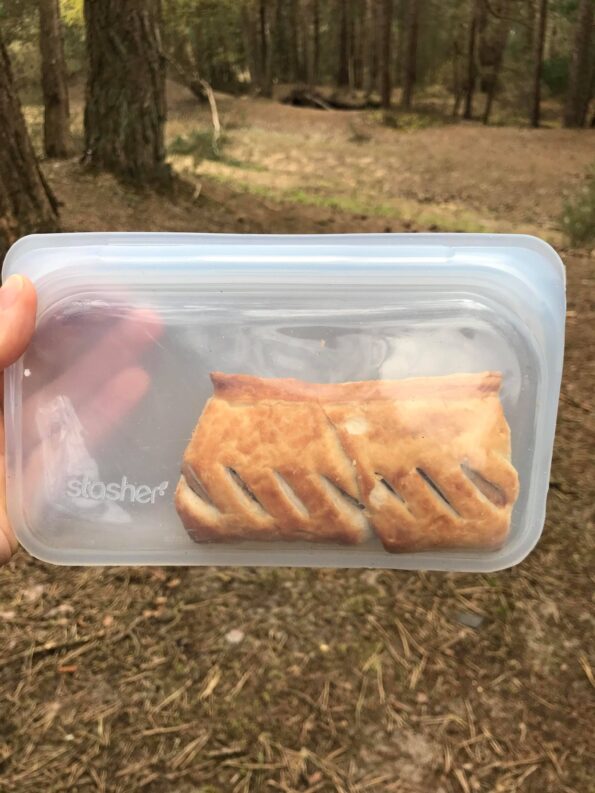 stasher bag with a sausage roll inside of it when out on a picnic