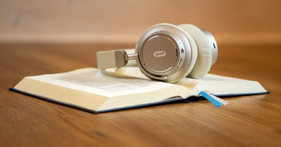 book with a set of headphones on the top