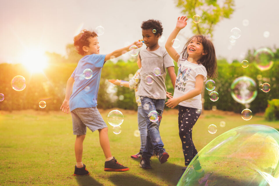 kids playing with bubbles