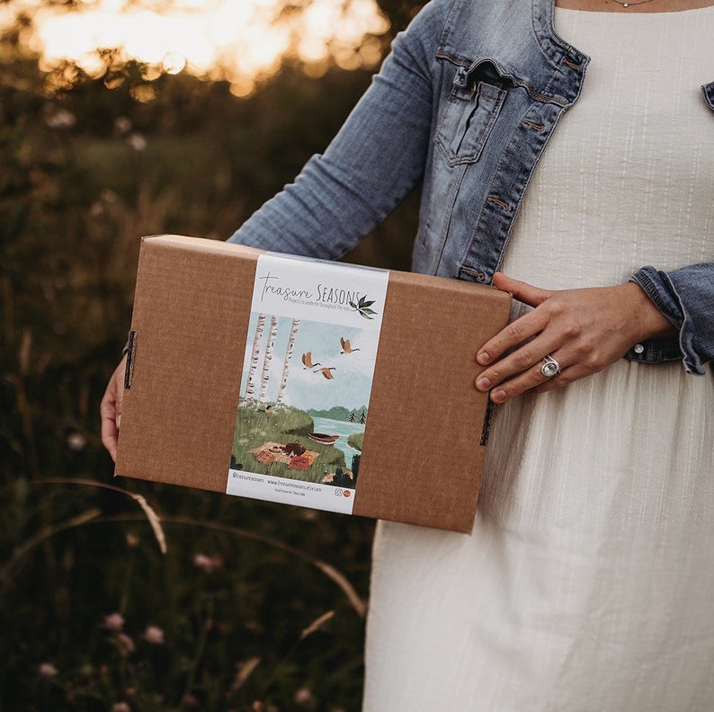 the treasure season summer box being held by Julia