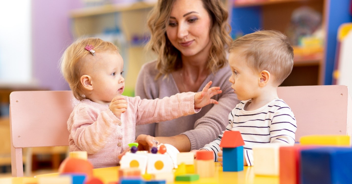 a lady with 2 children doing a childcare job