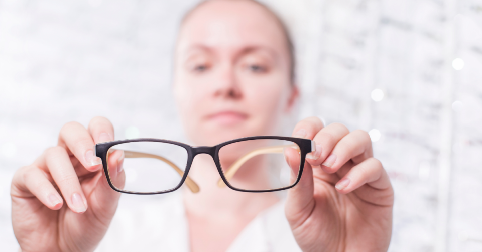 lady holding up glasses