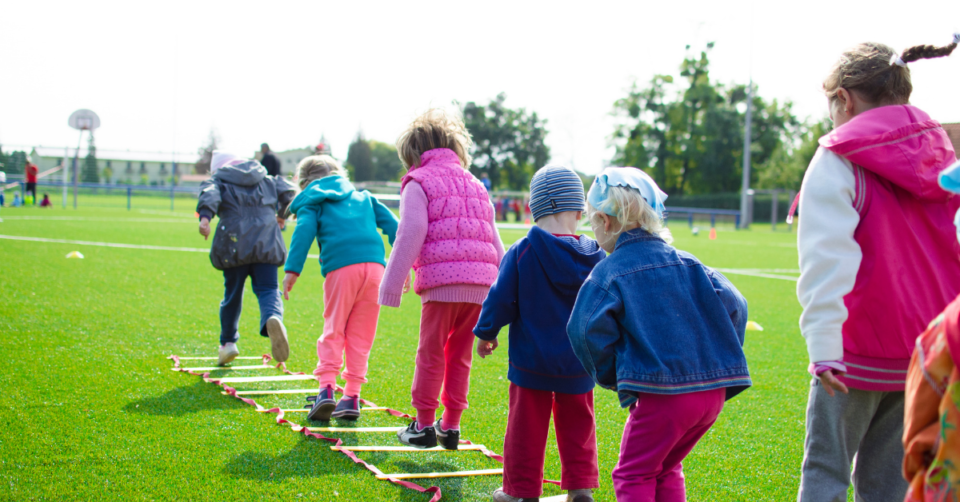 kids lined up doing activities