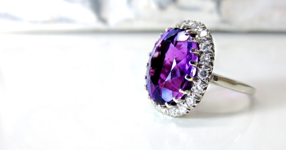 a vintage ring with a large purple amethyst stone